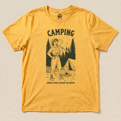 A yellow graphic t-shirt featuring a vintage-style illustration of a confident woman with an ax, text reads "Camping: Where No One Can Hear You Scream.