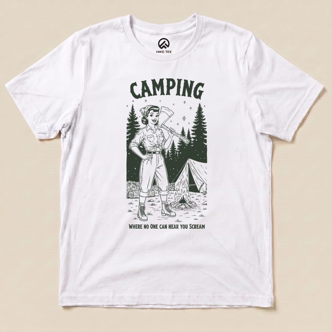 A graphic t-shirt featuring a retro camper with an axe, surrounded by trees and a tent, reads "Camping No One Hear Shirt.