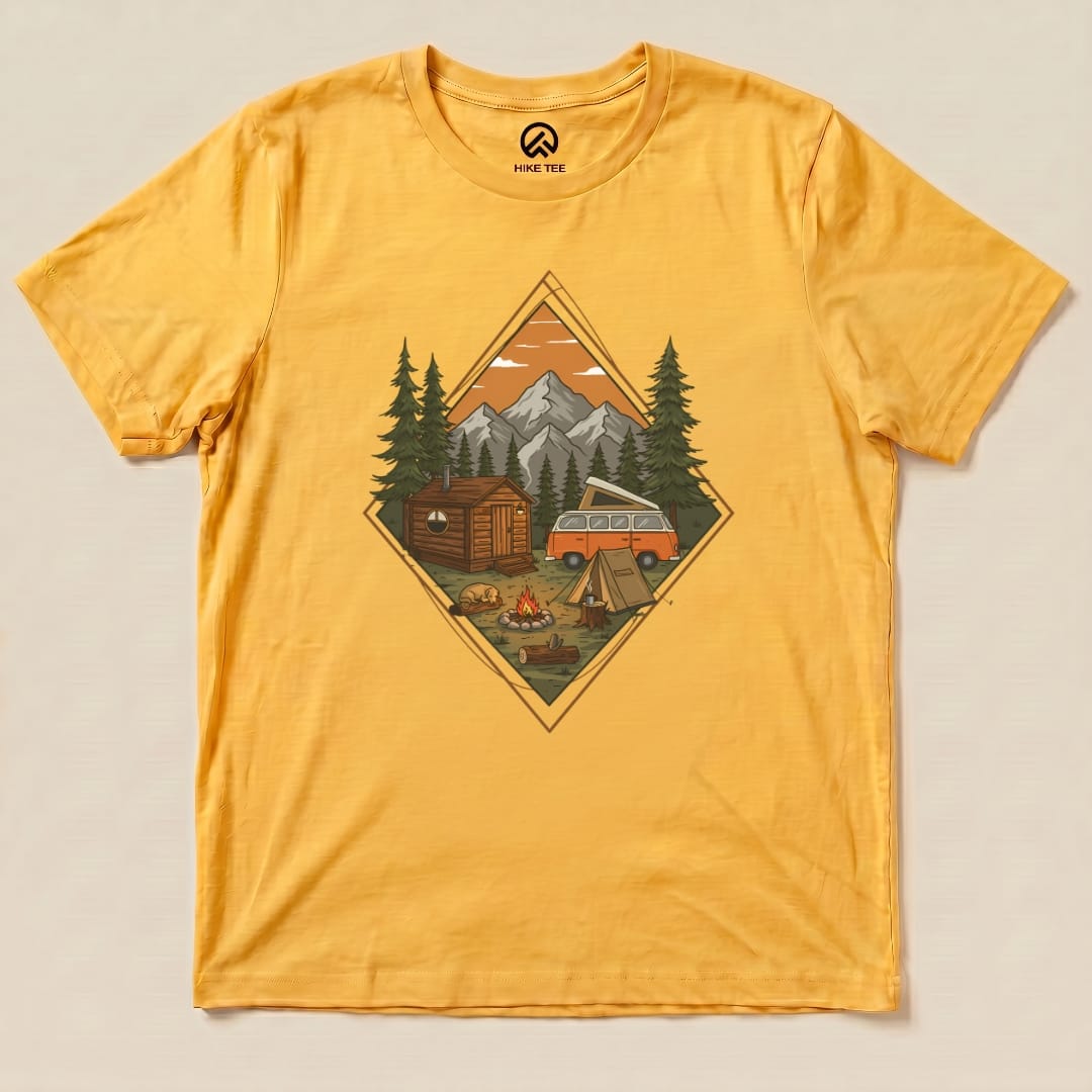 Graphic t-shirt featuring a Camping Scenery Shirt design, showcasing a campsite with mountains, a cabin, and a vintage camper van.