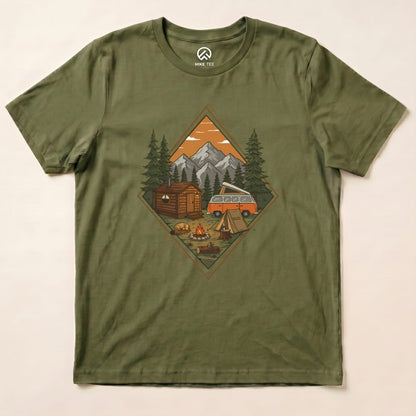 The Camping Scenery Shirt features a vibrant graphic of a campsite with mountains, a cabin, and a vintage van surrounded by trees.