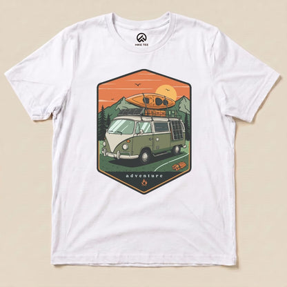 The graphic t-shirt features a vintage camping van with a canoe on top and the word "adventure" in a scenic outdoor design.