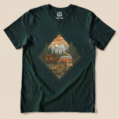 The Camping Vibes Shirt features a graphic of a cozy campsite with a cabin, tent, VW van, and a roaring campfire against a mountain backdrop.