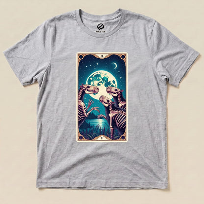 The graphic t-shirt features a colorful "Capybara Moon Tarot Card Shirt" design, showcasing skeletal animals under a full moon.