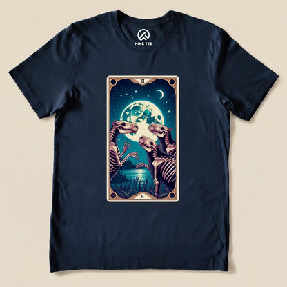 Graphic t-shirt featuring a whimsical "Capybara Moon Tarot Card Shirt" design with skeletal capybaras under a full moon.