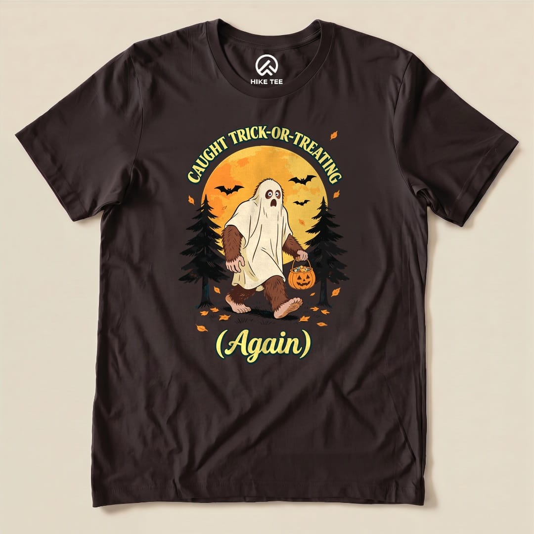 Brown Caught Trick-or-Treating Again Shirt with a Bigfoot in a ghost sheet trick-or-treating graphic