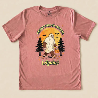Heather Mauve Caught Trick-or-Treating Again Shirt with a Bigfoot in a ghost sheet trick-or-treating graphic