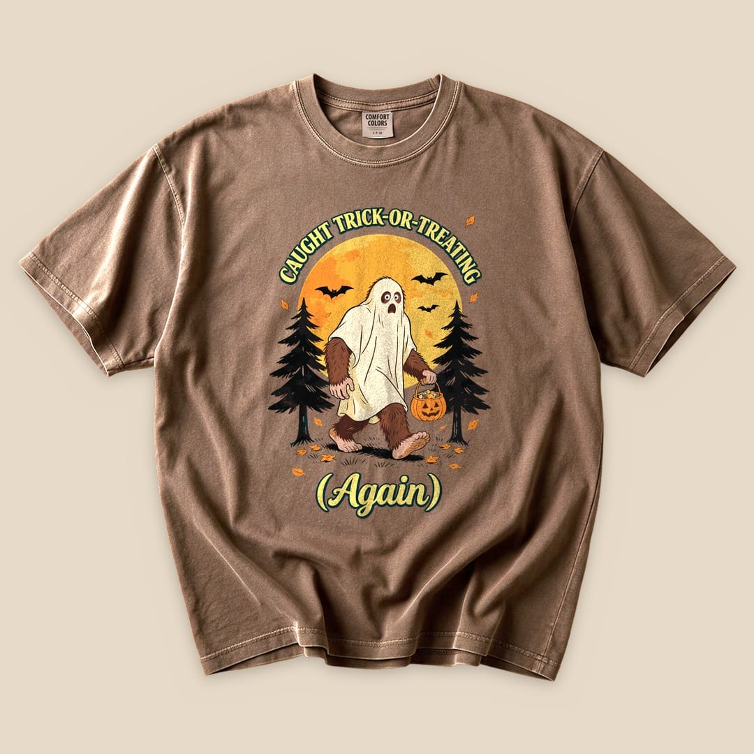 Espresso Caught Trick-or-Treating Again T-Shirt with a Bigfoot in a ghost sheet trick-or-treating graphic
