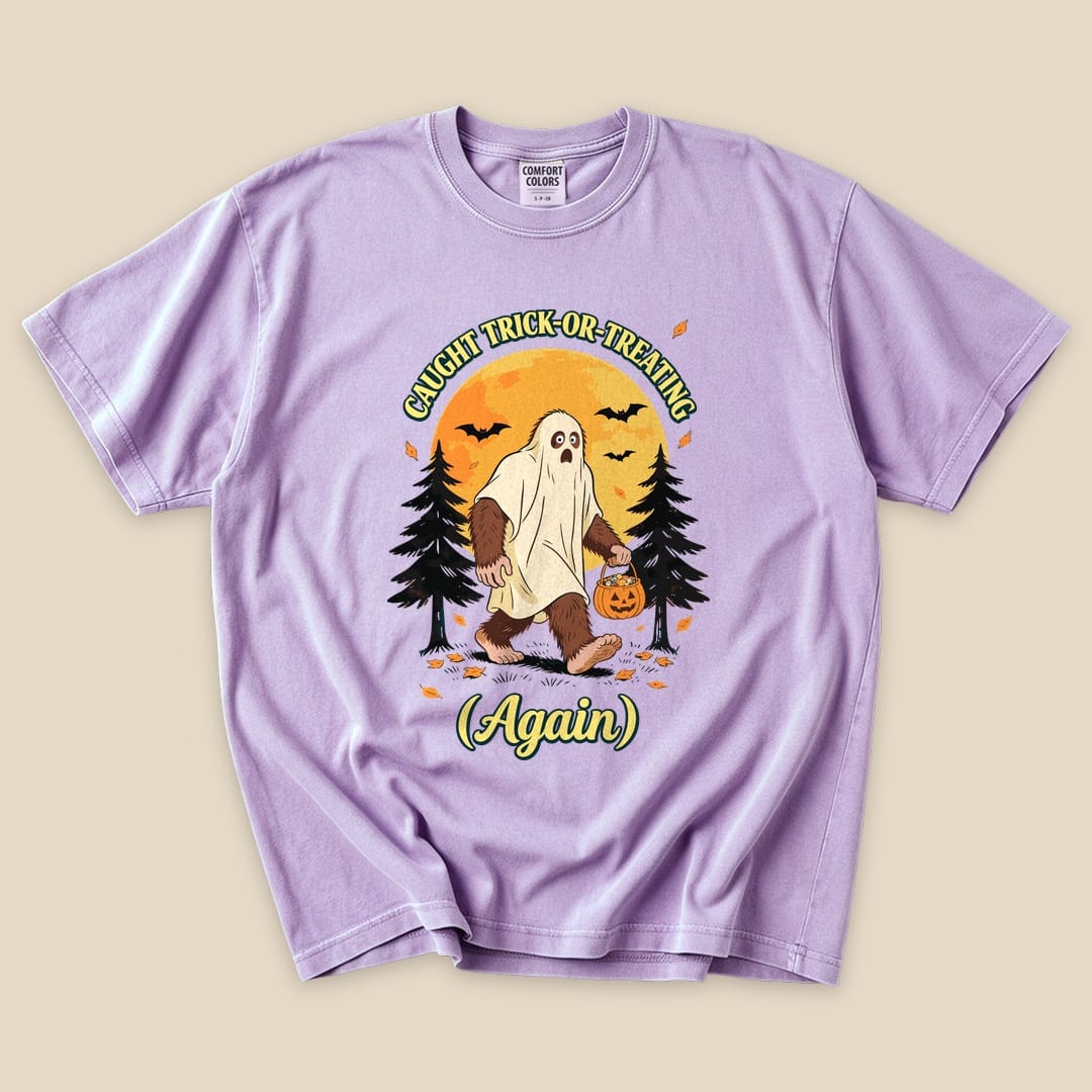 Orchid Caught Trick-or-Treating Again T-Shirt with a Bigfoot in a ghost sheet trick-or-treating graphic