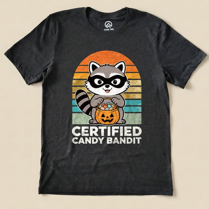 Dark Grey Heather Certified Candy Bandit Shirt with a masked raccoon holding a pumpkin candy bucket graphic