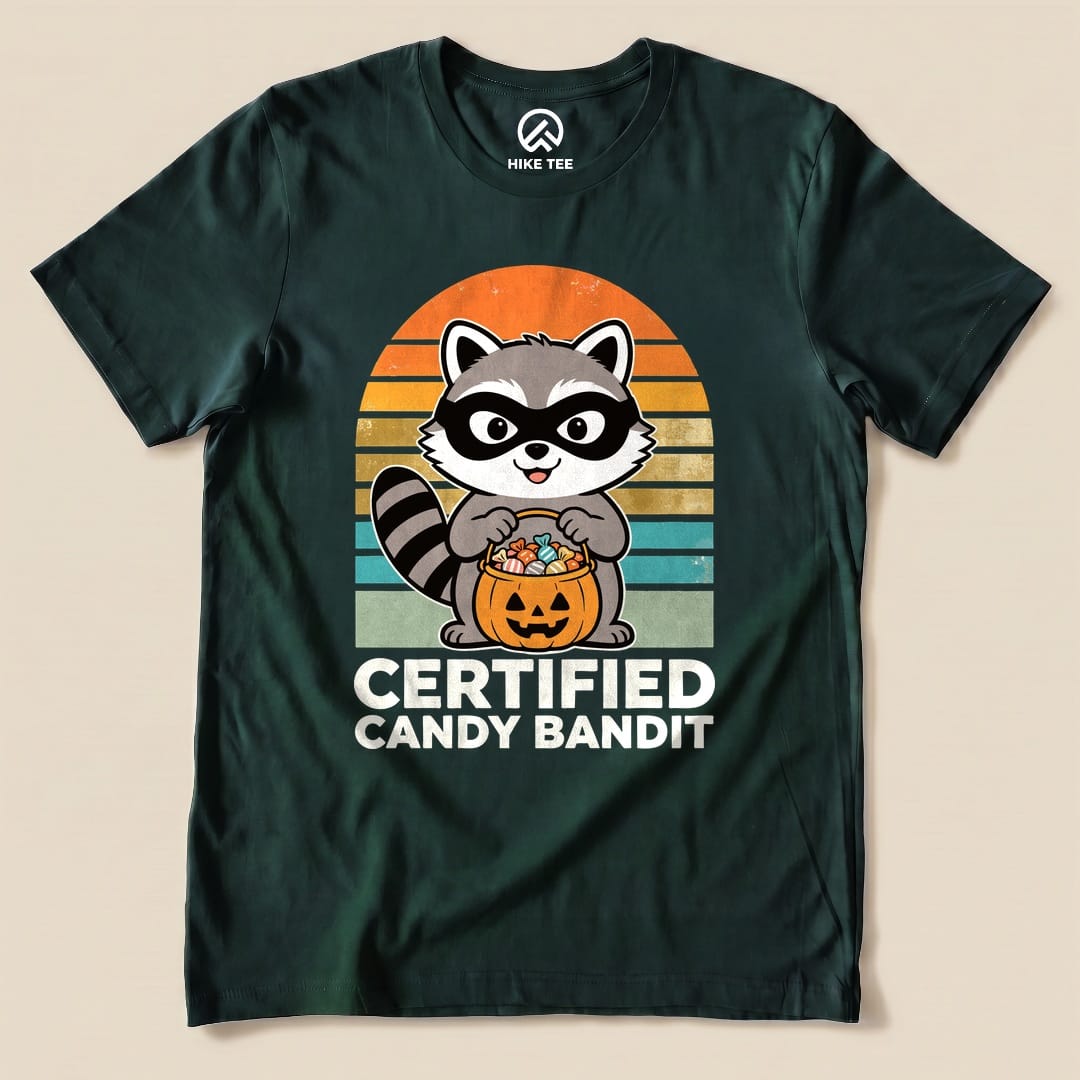 Forest Certified Candy Bandit Shirt with a masked raccoon holding a pumpkin candy bucket graphic