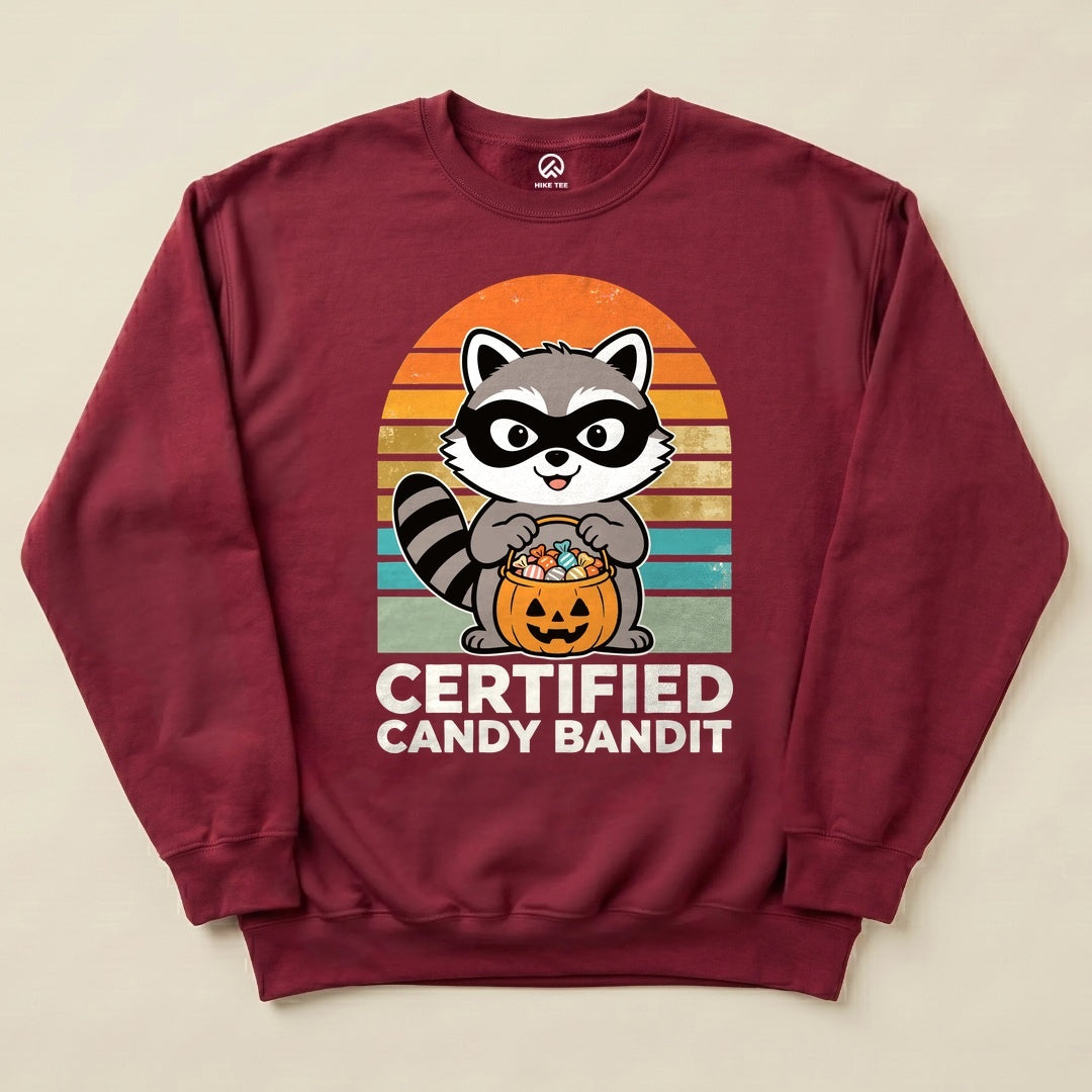 Maroon Certified Candy Bandit Sweatshirt with a masked raccoon holding a pumpkin candy bucket graphic