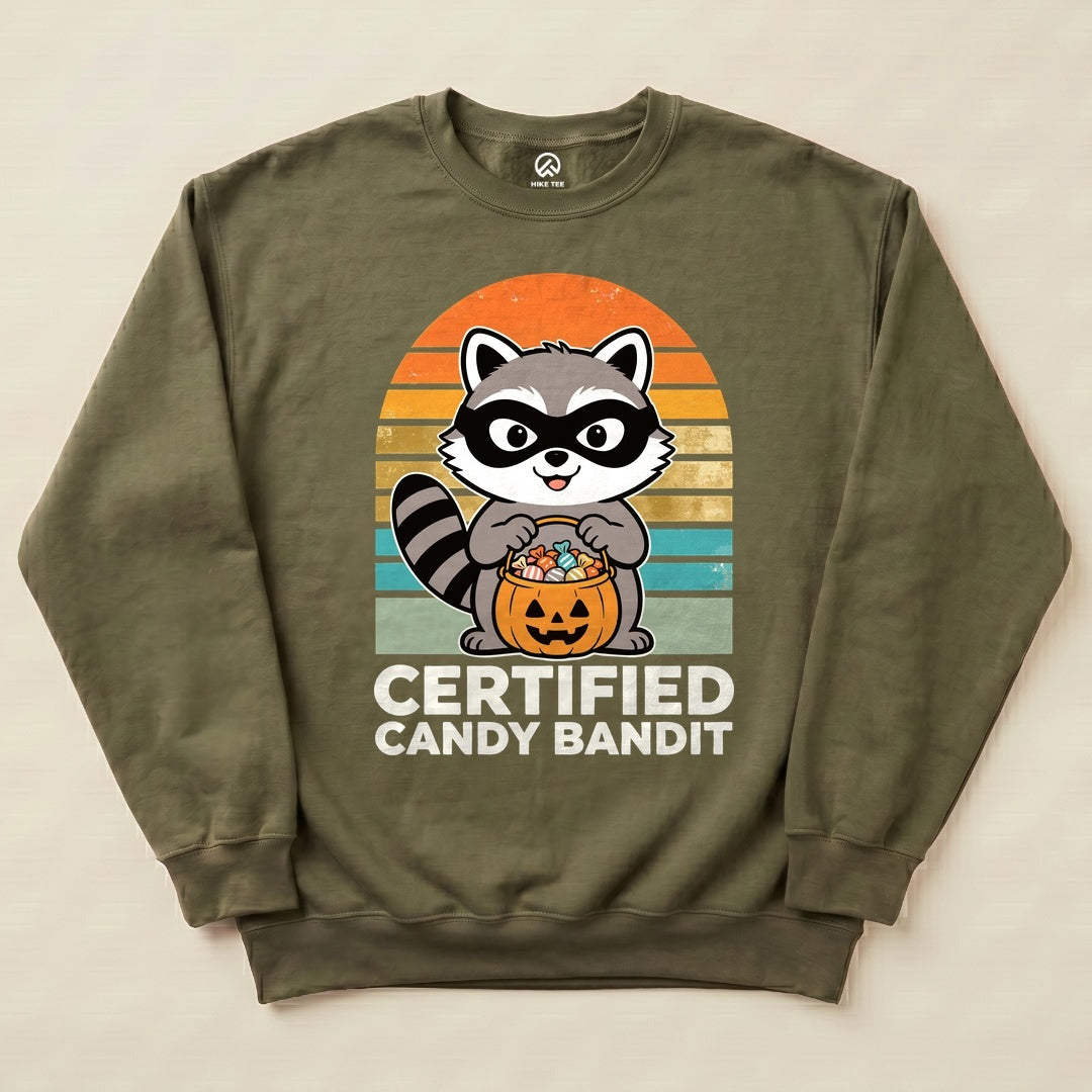 Military Green Certified Candy Bandit Sweatshirt with a masked raccoon holding a pumpkin candy bucket graphic