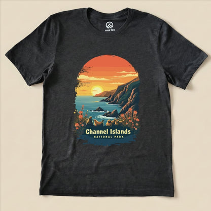 The graphic t-shirt features a vibrant sunset over the ocean with stylized cliffs and flowers, labeled "Channel Islands National Park.