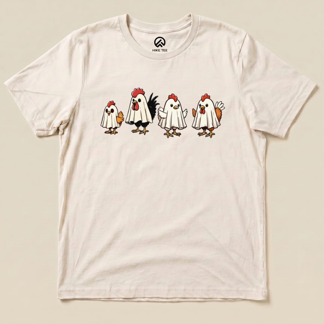 A graphic t-shirt featuring four chickens dressed as ghosts with playful expressions, labeled as the "Chicken Ghost Shirt.