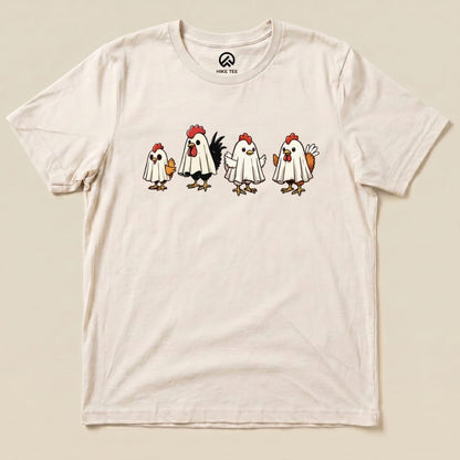 A graphic t-shirt featuring four chickens dressed as ghosts with playful expressions, labeled as the "Chicken Ghost Shirt.