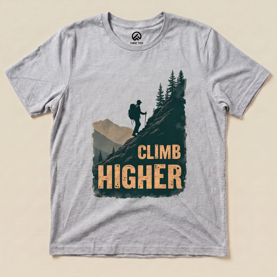 Athletic Heather Climb Higher Shirt with a hiker climbing a mountain graphic