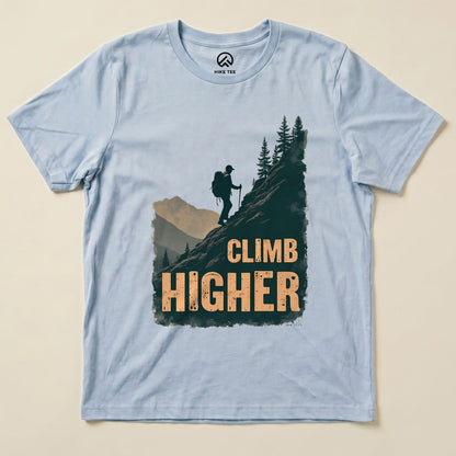 Baby Blue Climb Higher Shirt with a hiker climbing a mountain graphic