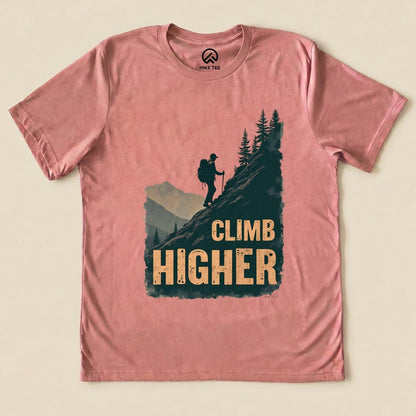 Heather Mauve Climb Higher Shirt with a hiker climbing a mountain graphic