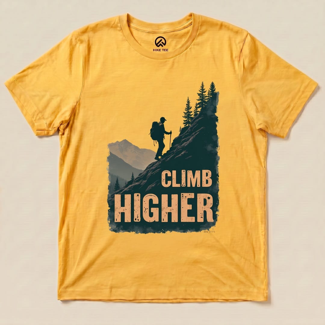 Yellow Gold Climb Higher Shirt with a hiker climbing a mountain graphic