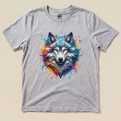 A graphic t-shirt featuring a vibrant, colorful wolf design with splashes of paint against a gray background.