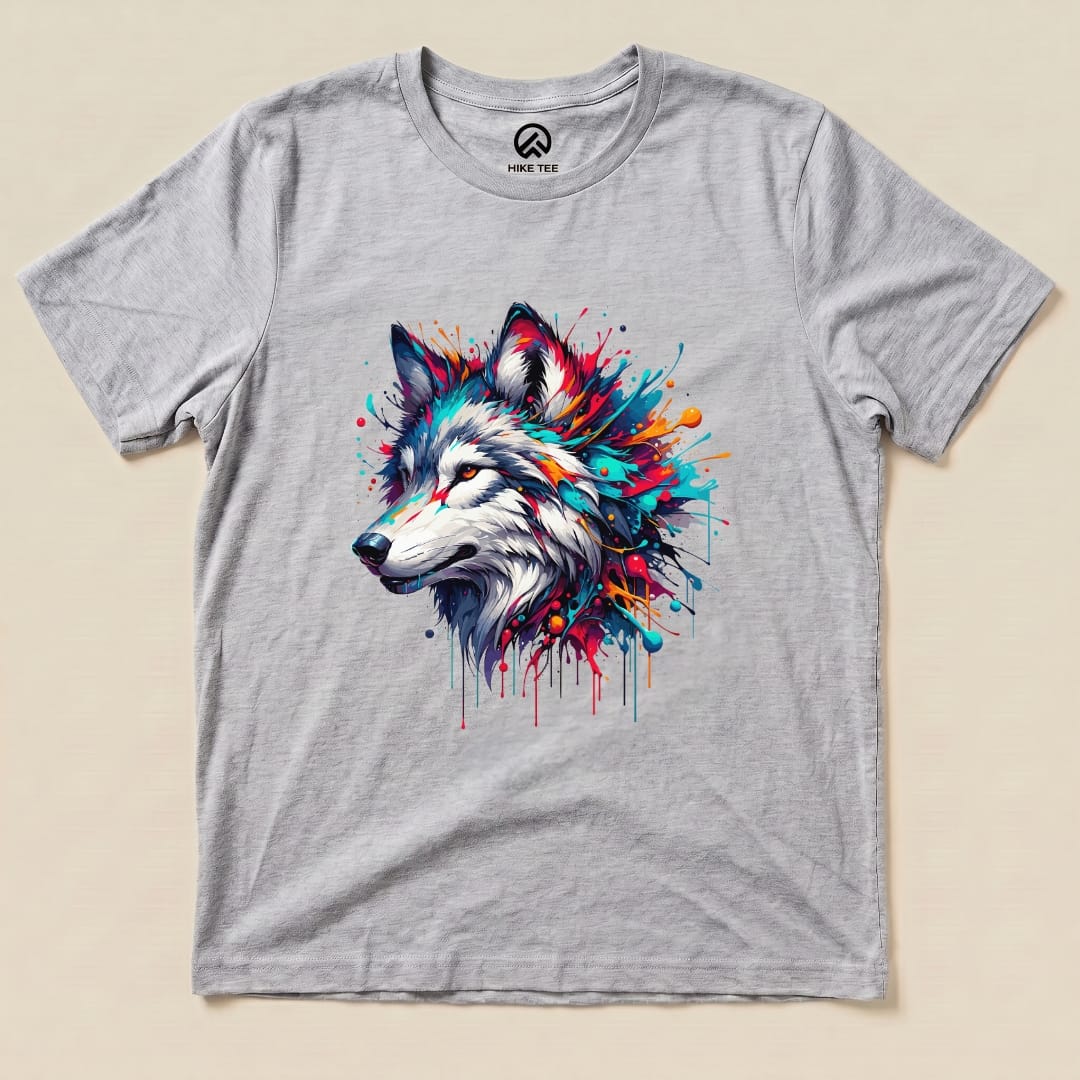A graphic t-shirt featuring a colorful wolf design with splashes of paint on a light gray background, labeled as "Colorful Wolf Shirt.