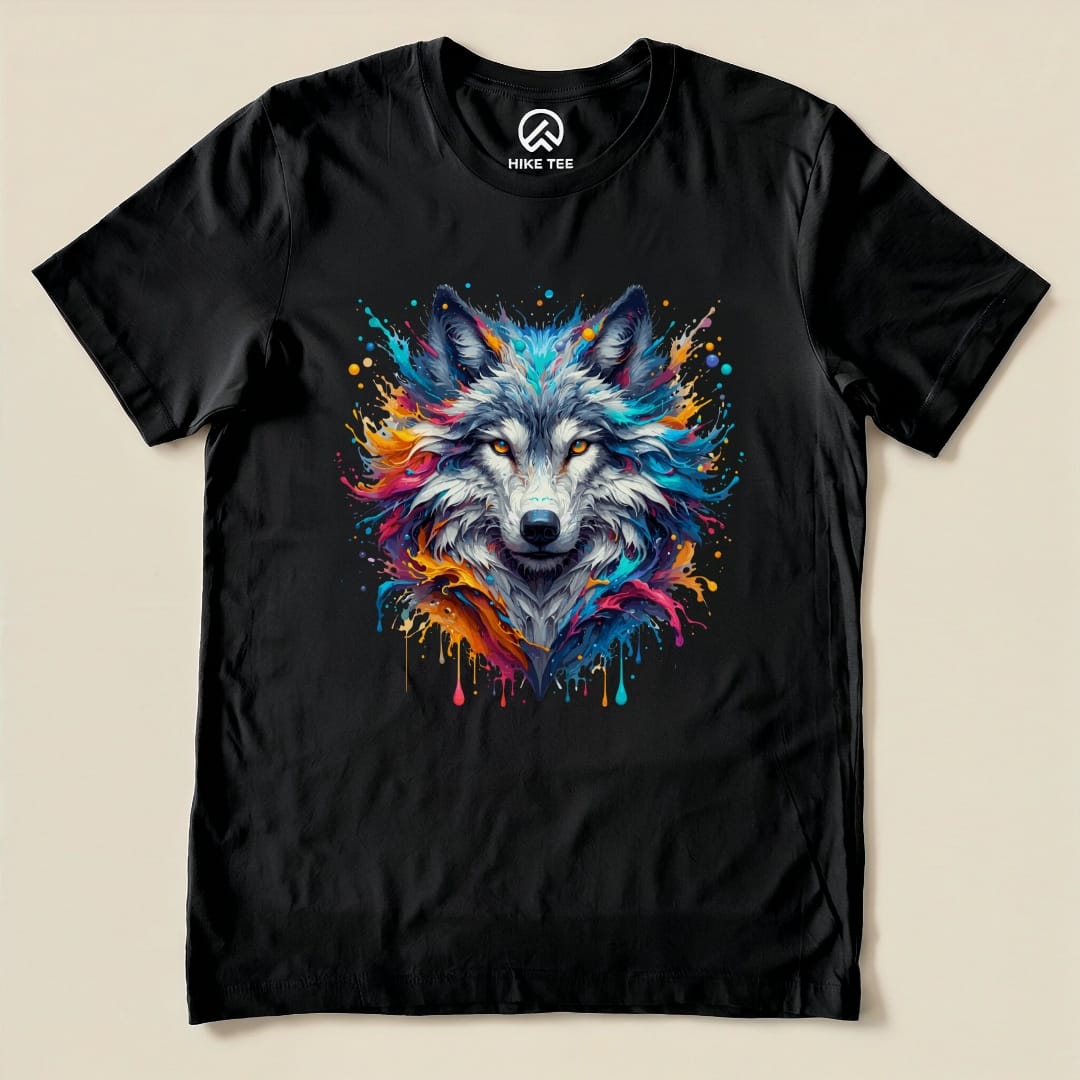 A colorful wolf shirt featuring a vibrant wolf graphic with splashes of paint on a black background, showcasing a striking design.
