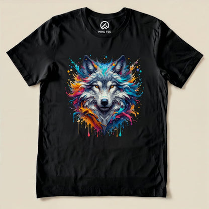 A colorful wolf shirt featuring a vibrant wolf graphic with splashes of paint on a black background, showcasing a striking design.