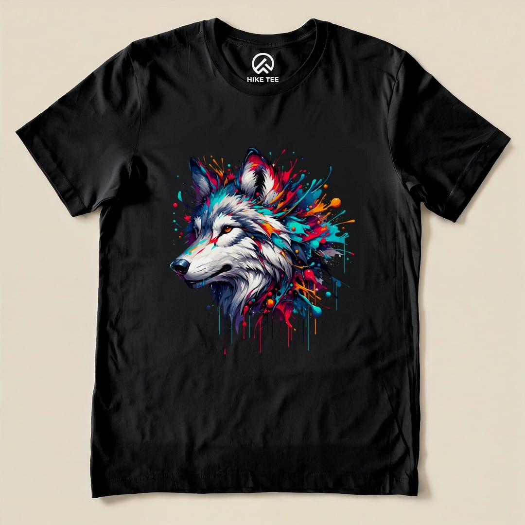 A colorful wolf graphic is printed on a black Hike Tee shirt, showcasing vibrant splashes of color around the wolf's head.