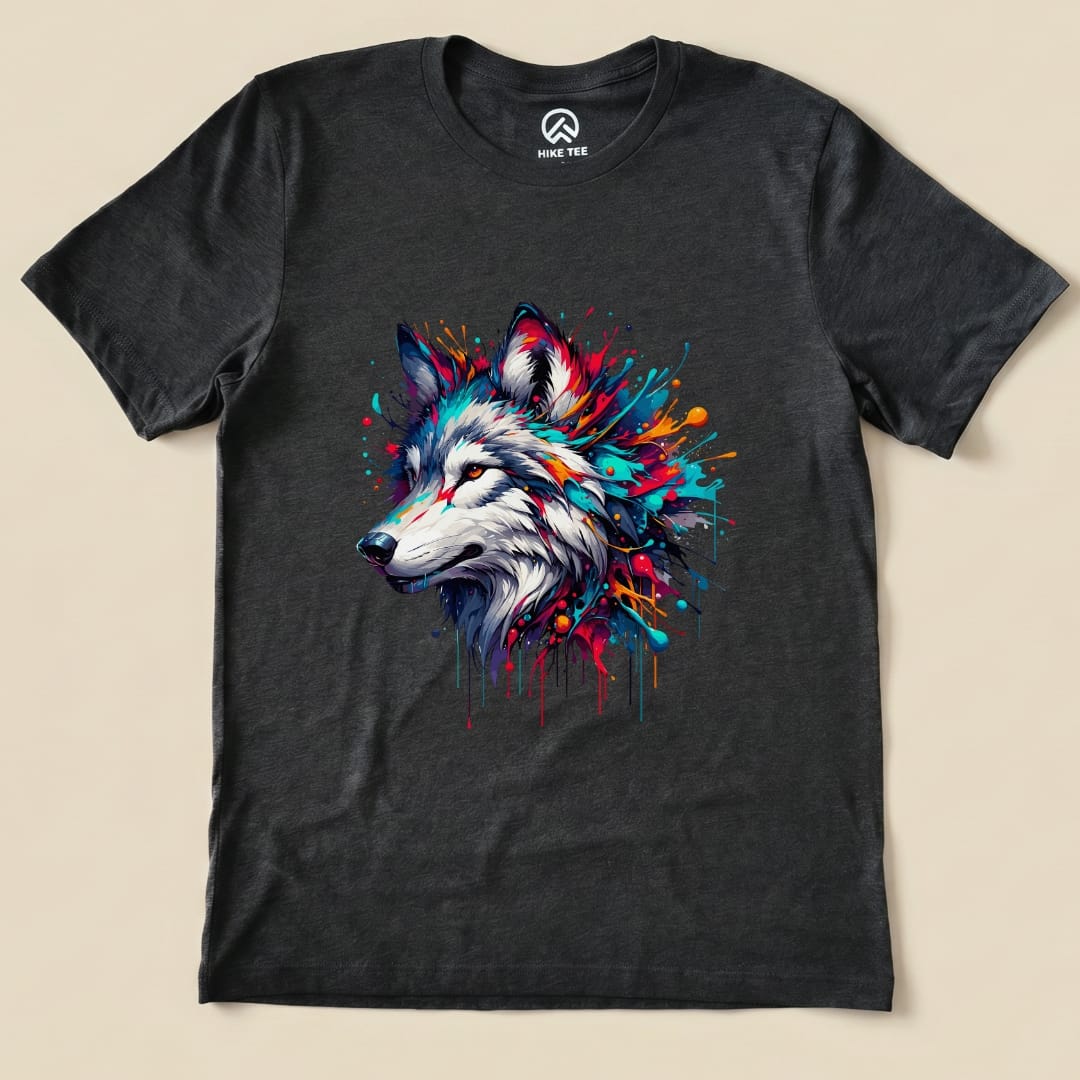 A colorful wolf design with vibrant splashes is featured on this graphic t-shirt from Hike Tee.