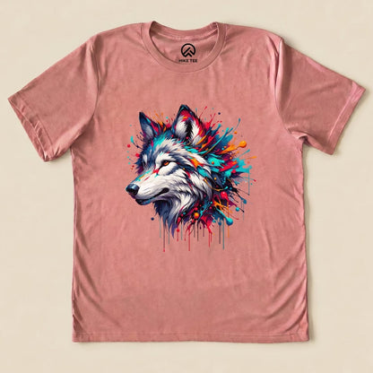 A colorful wolf graphic is prominently featured on a pink graphic t-shirt from Hike Tee, showcasing vibrant splashes of paint.