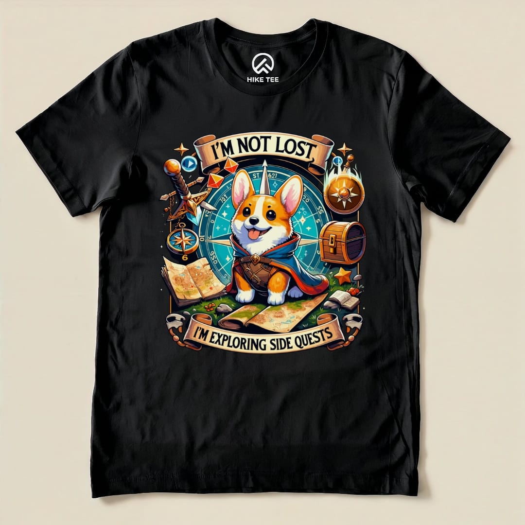 The Corgi I'm Not Lost Shirt features a playful corgi in a cape with a map and compass, surrounded by adventure-themed graphics.