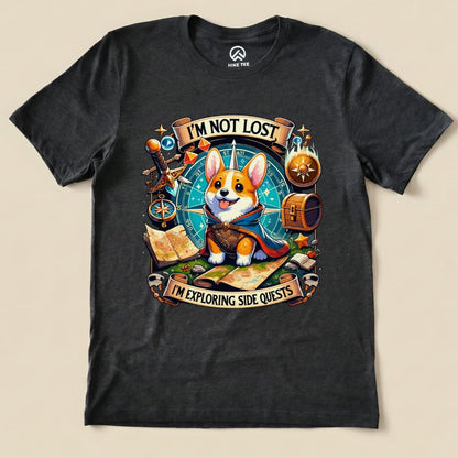 A graphic t-shirt featuring a cute corgi wearing a cape with the text "I'M NOT LOST, I'M EXPLORING SIDE QUESTS.