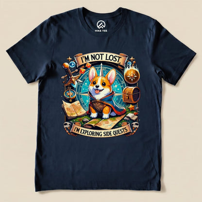 A navy graphic t-shirt features a playful corgi in a cape, with the text "I'M NOT LOST, I'M EXPLORING SIDE QUESTS" above.