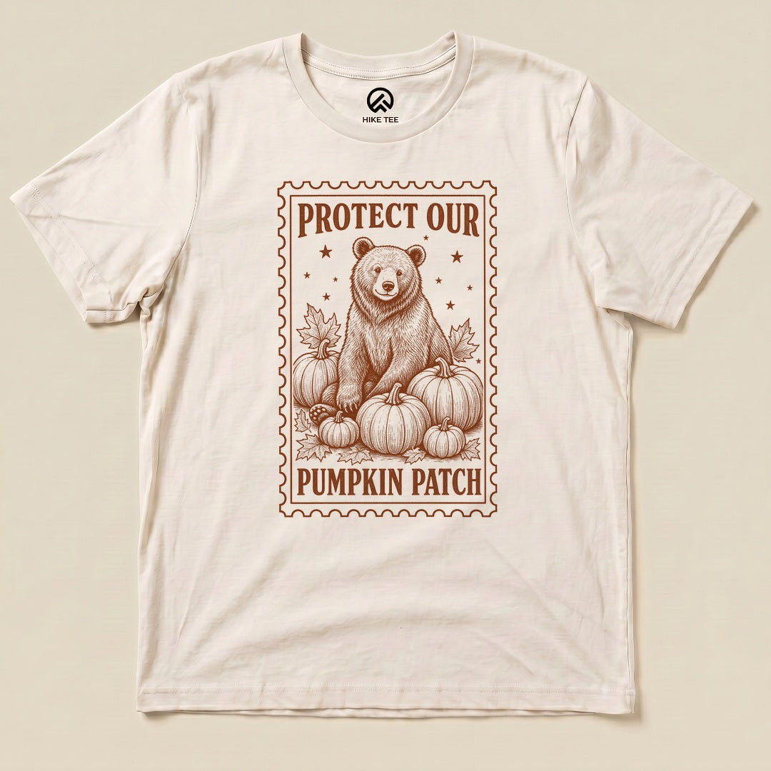 Natural Protect Our Pumpkin Patch Shirt with a bear among pumpkins in a vintage stamp frame graphic