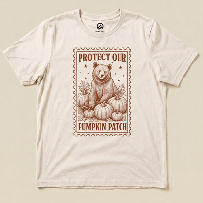 Natural Protect Our Pumpkin Patch Shirt with a bear among pumpkins in a vintage stamp frame graphic