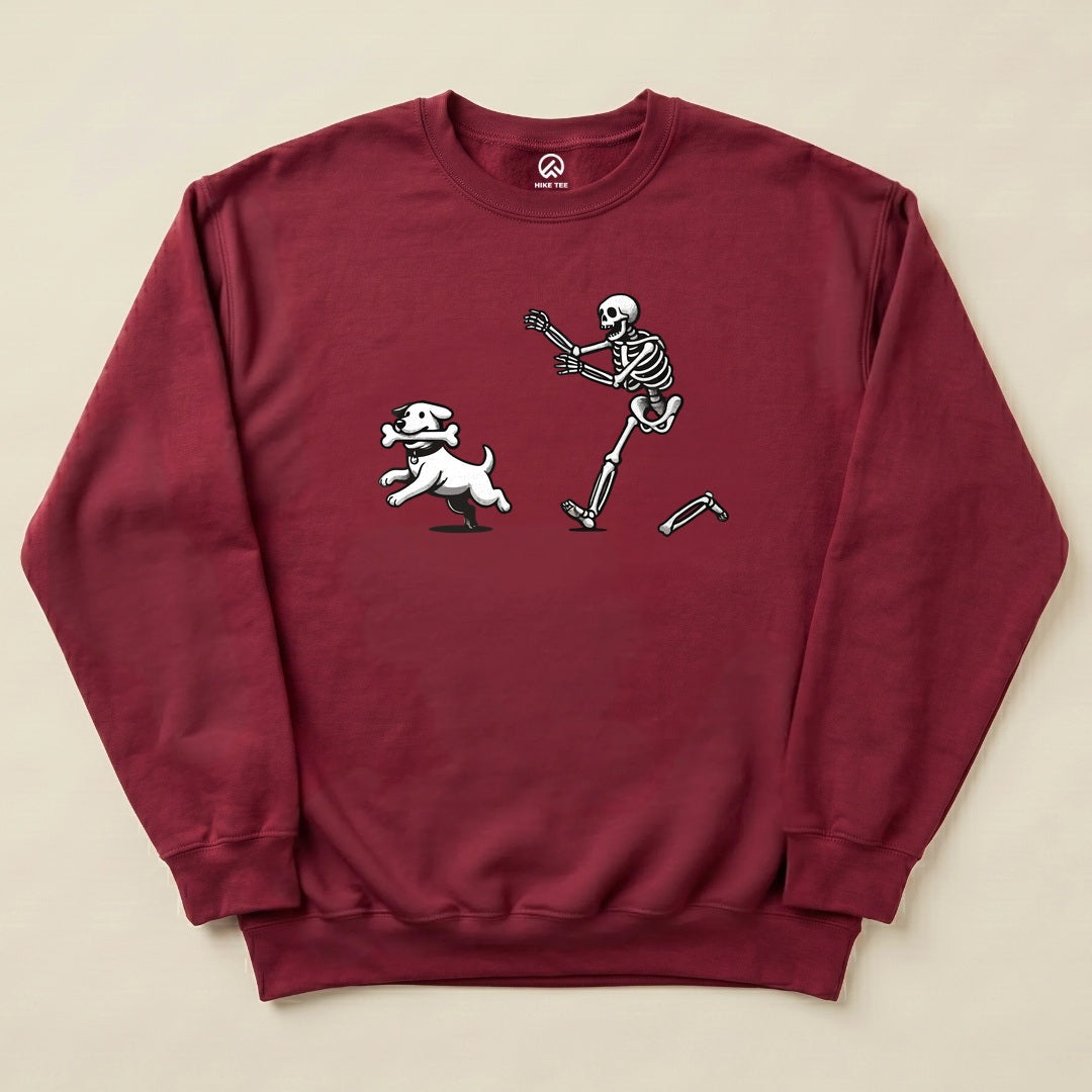 A maroon "Skeleton and Dog Sweatshirt" features a playful graphic of a skeleton chasing a white dog, adding a humorous touch to outdoor attire.