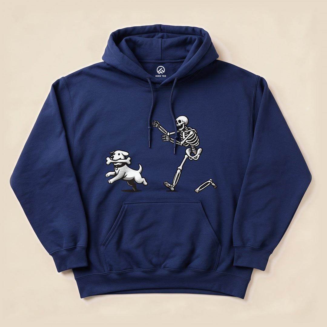 A navy Skeleton and Dog Hoodie features a playful graphic of a skeleton running alongside a dog with a bone.