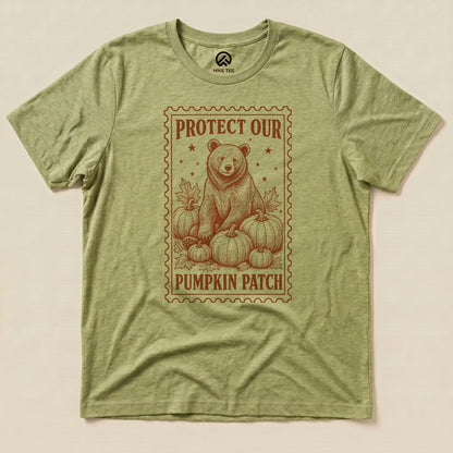 Heather Green Protect Our Pumpkin Patch Shirt with a bear among pumpkins in a vintage stamp frame graphic