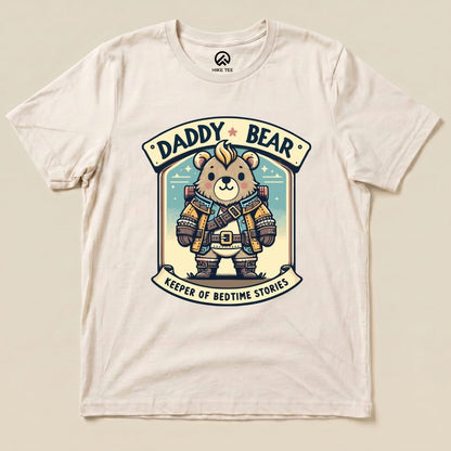 A cream graphic t-shirt features a cartoon bear in a vest, with the text "DADDY BEAR" and "KEEPER OF BEDTIME STORIES.