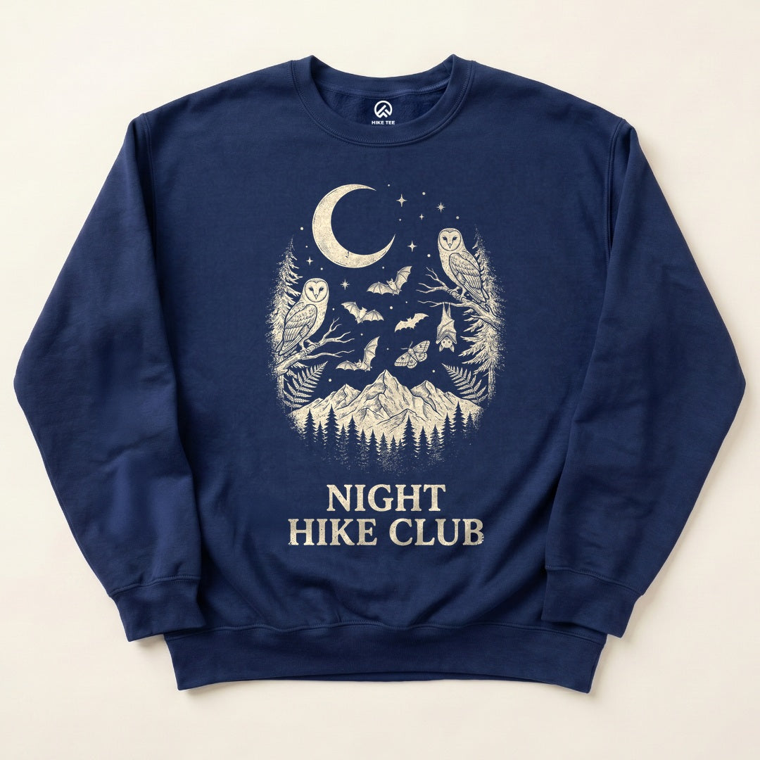 Navy Night Hike Club Sweatshirt with owls, bats and a crescent moon over the mountains graphic