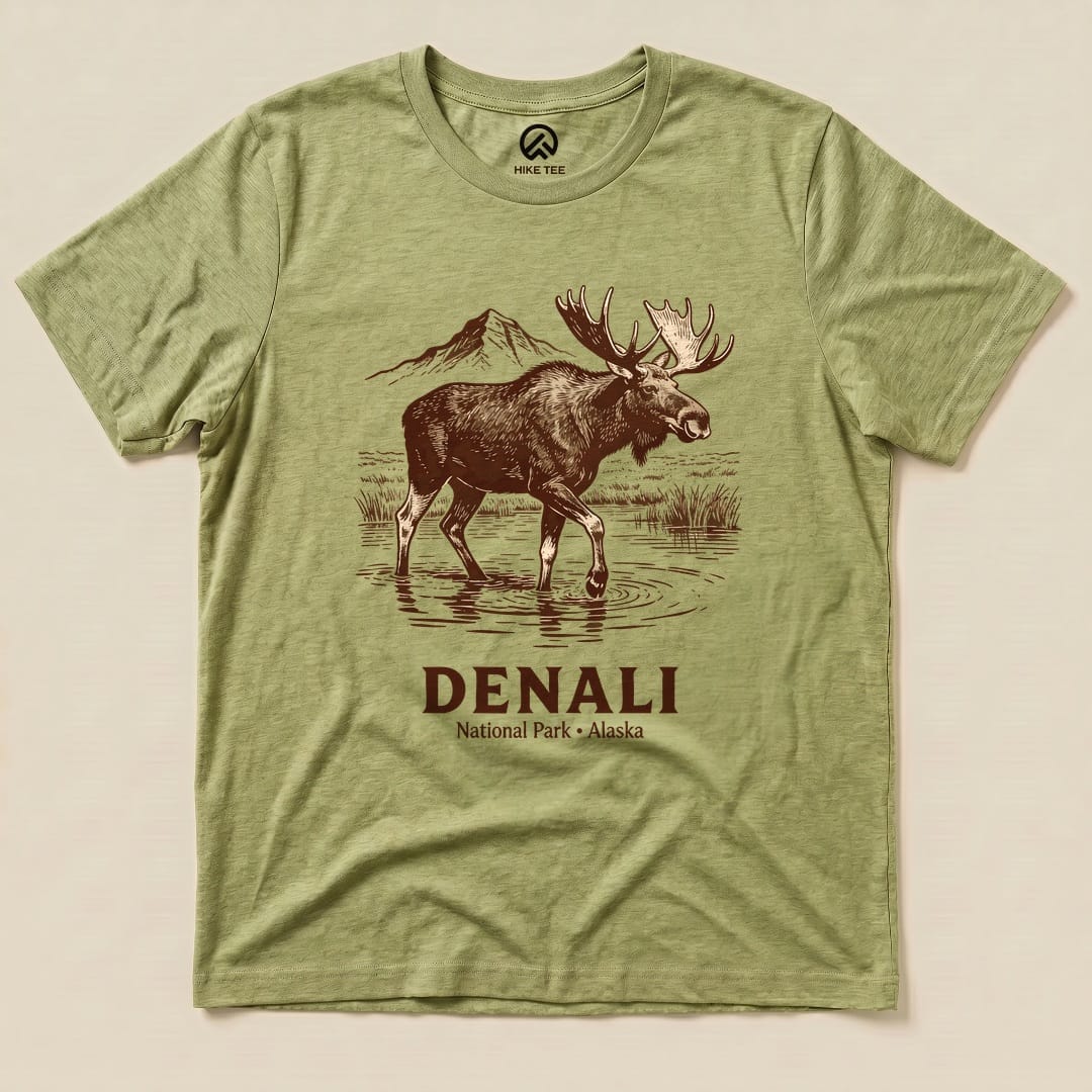 A graphic t-shirt featuring a moose standing in water with the text "DENALI National Park - Alaska" below.