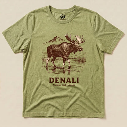 A graphic t-shirt featuring a moose standing in water with the text "DENALI National Park - Alaska" below.