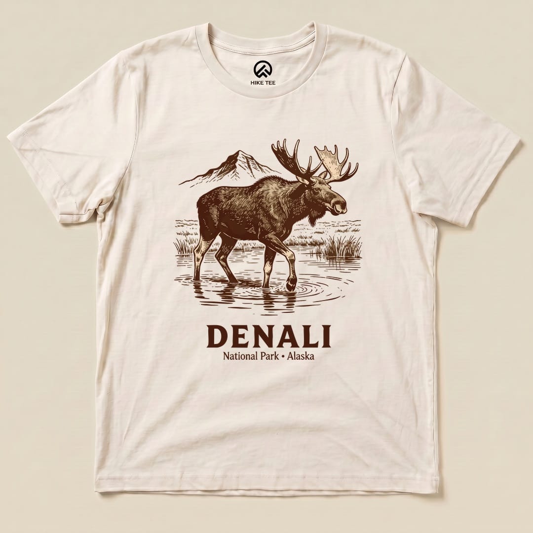 Graphic t-shirt featuring a moose standing in water with mountains in the background, labeled "Denali National Park Moose Shirt.