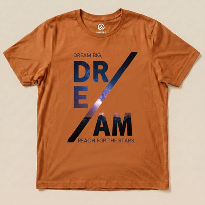 The graphic t-shirt features the phrase "DREAM BIG, DREAM REACH FOR THE STARS" on an orange background, creating a motivational aesthetic.