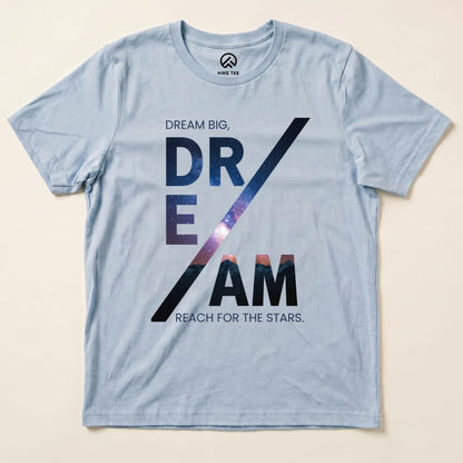 A light blue graphic t-shirt featuring the words "Dream Big, DREAM / Reach for the Stars" with a cosmic background.
