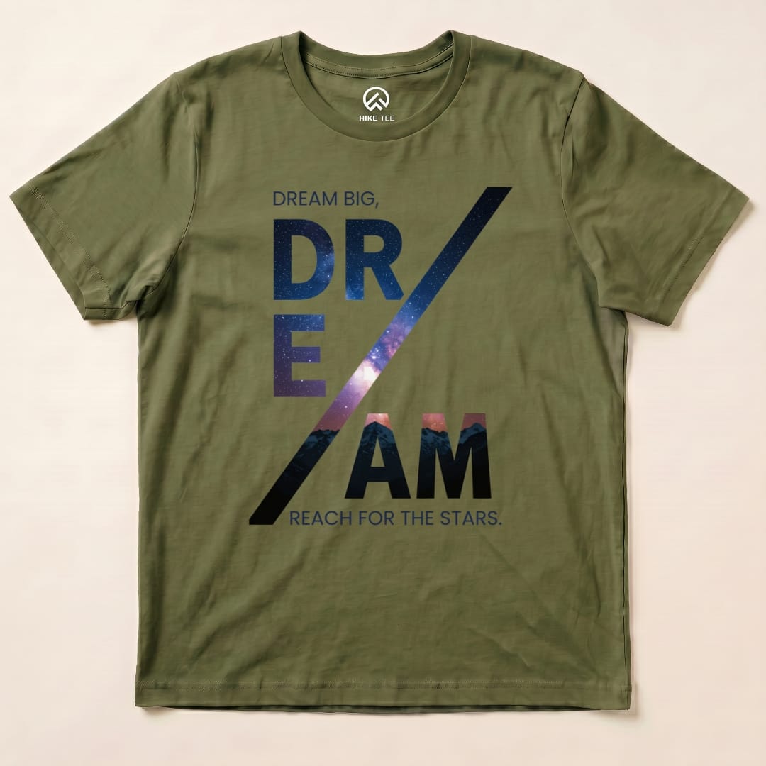A graphic t-shirt in olive green featuring the slogan "DREAM BIG, REACH FOR THE STARS" in a starry design, labeled as a Dream Motivational Shirt.
