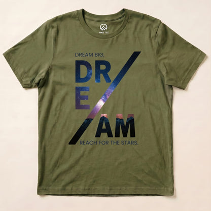 A graphic t-shirt in olive green featuring the slogan "DREAM BIG, REACH FOR THE STARS" in a starry design, labeled as a Dream Motivational Shirt.