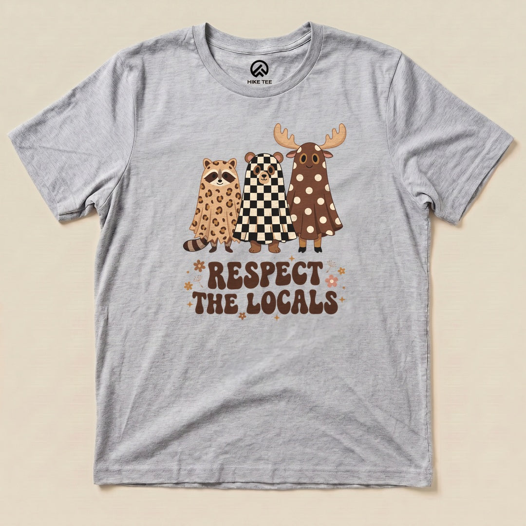 Athletic Heather Respect the Locals Ghosts Shirt with a trio of raccoon and moose ghosts in retro patterns graphic