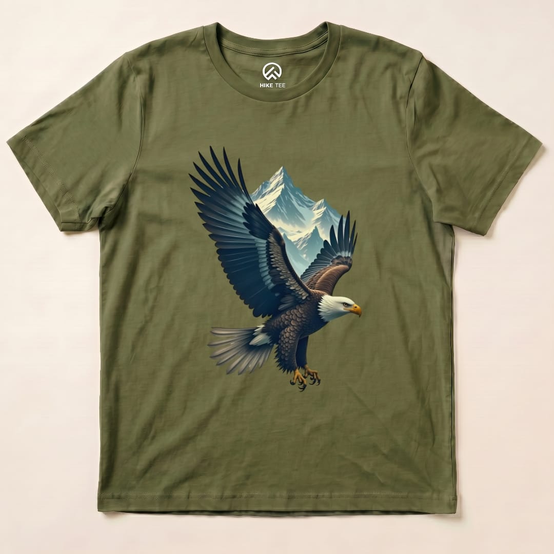 A graphic t-shirt featuring an eagle in flight with mountains in the background, labeled as the "Eagle and Mountain Shirt.