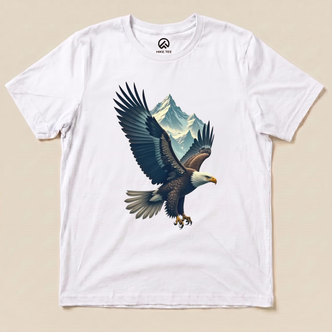 A graphic t-shirt featuring an eagle in flight over mountain peaks, labeled as the "Eagle and Mountain Shirt".